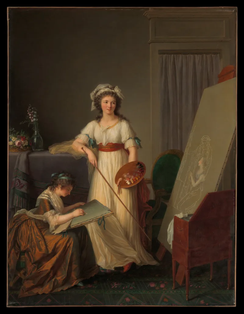 Dos mujeres trabajan juntas en un estudio de pintura, una ante el caballete y otra con un cuaderno.
